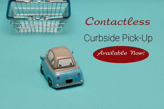 Sign CONTACTLESS CARBSITE PICKUP. Toy car and shopping cart on blue background. The concept of self-delivery of goods