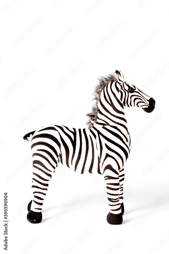 Wall mural Zebra doll made from fabric is stand alone isolated on white background.