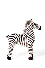 Obraz na płótnie Canvas Zebra doll made from fabric is stand alone isolated on white background.