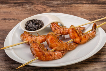 Grilled prawn skewer with pepper sauce