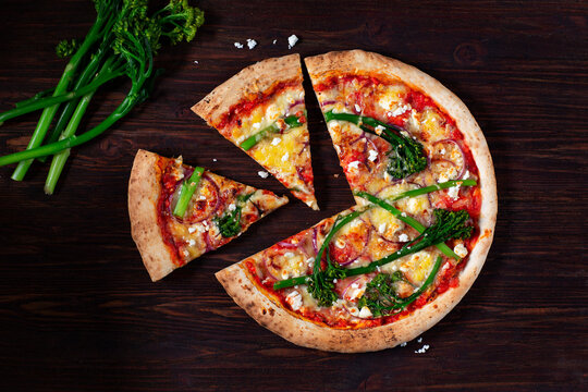 Vegetable pizza with bimi, tomatoes, red onions and feta