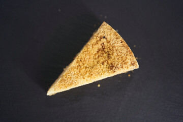 Delicious cake on a black tray. Top view