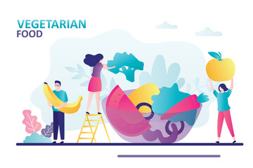 People eats vegetarian food. Large plate with fresh vegetables and fruits. Concept of healthy lifestyle and organic food. Male character holds banana