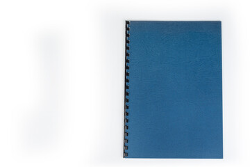 Closed New notebook with  a binding on a white