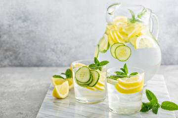 Refreshing lemonade with cucumber in a pitcher