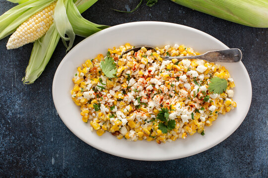 Mexican street corn, elote with cotija cheese, fresh cilantro and chili