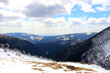 Early spring in the mountains. Snow-covered Karkonosze in early spring. Karkonosze, Poland