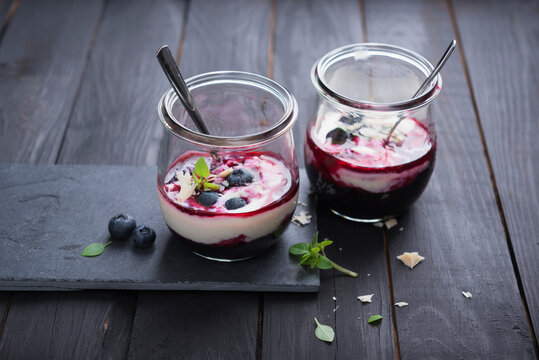 Almond yogurt with blueberry compote in a glass