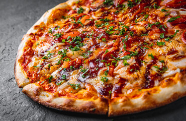 Pizza with chicken and barbeque sauce. Italian pizza on Dark grey black slate background