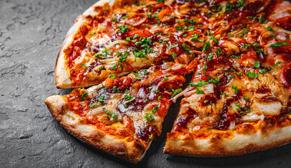 Pizza with chicken and barbeque sauce. Italian pizza on Dark grey black slate background