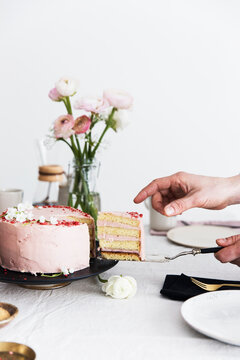A sliced strawberry cream cake