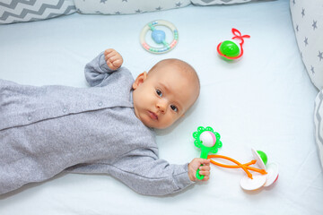 Newborn baby girl 4 months old lies in a lullaby