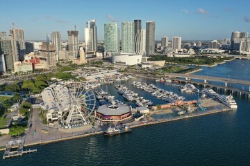 Fototapeta na wymiar Miami, Florida - November 26, 2020 - Aerial view of Bayside Marketplace, City of Miami Marina and Miami skyline on sunny autumn morning.