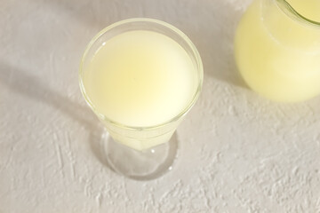 A glass of whey on a bright background