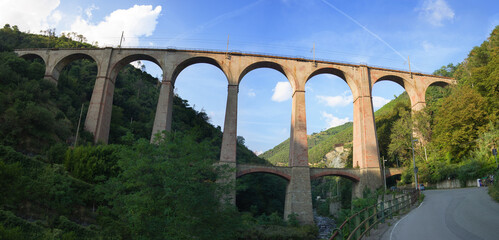 Old arched railway bridge made with bricks