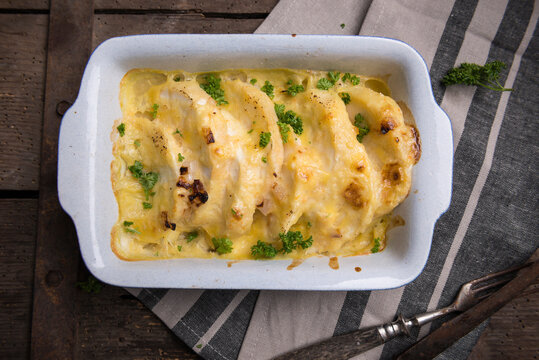 Celeriac gratin in a creamy cashew nut sauce topped with vegan cheese