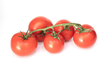 A branch of Fresh juicy red cherry tomatoes on a white background. 