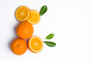 Whole and sliced orange fruit on white background