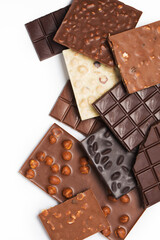 Many various chocolate bars and nuts