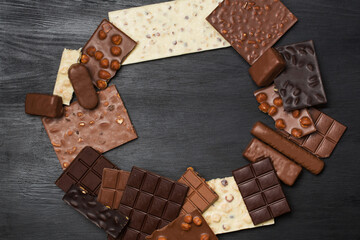 Many various chocolate bars and nuts