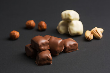 Small chocolate bars, white and milk chocolate with nuts and pistachio