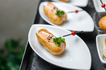 Roll with pate, seasoned with herbs and spices on a plate. Copy space