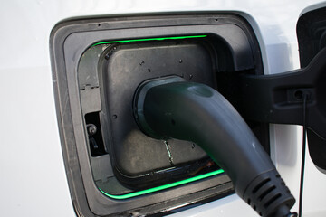 Electric Car Charger At Home - Charging EV with lights on