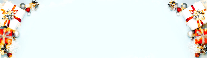 Christmas decorations on the blue background. Flat lay, top view with copy space for your text, wide angle view. Banner.