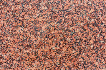 Abstract red granite textured background with copy space for your text and decorations.