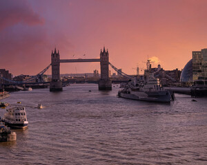 London England, the tower bridge over Thames river under dramatic sky