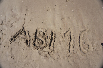 high school graduation 2016 lettering in the sand on the beach
