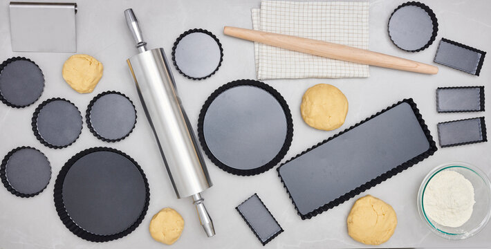 Various tart and pie shapes with a rolling pin