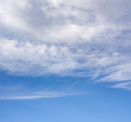 Sky background, lower part is clear blue, upper with cirrus clouds