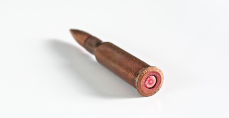 Fototapeta na wymiar Copper machine gun bullet laying - isolated on white background