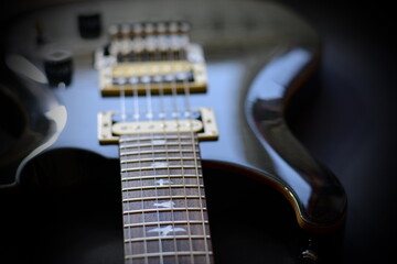 Fototapeta na wymiar Electric guitar on a dark background.