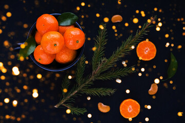 Christmas and New Year concept with Tangerines and lights