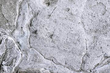Natural stone distressed and shabby surface. Rock background with scratched texture.
