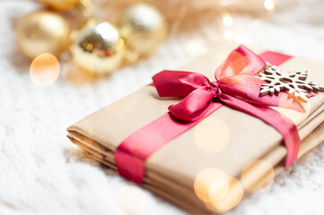 Fototapeta na wymiar christmas gift box with ribbon and christmas decorations