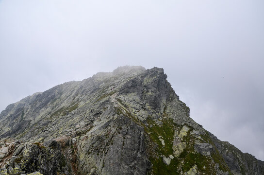 Mountain peaks, low clouds and fog. High Tatras Mountains in Slovakia
