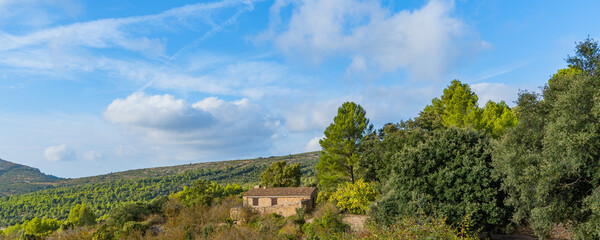 Fototapeta na wymiar Traditional small building at Llaberia in the countryside Catalonia, Serra de Llaberia. Tarragona, Catalonia, Spain