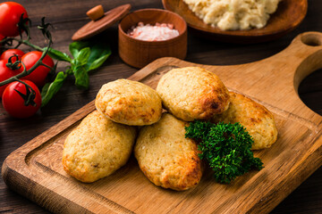 chicken cutlets with herbs on a dark wooden background, homemade chicken cutlets Free copy space