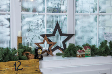 Christmas decorations on old wooden window. Wood Stars