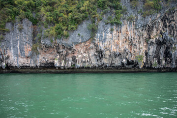 rocks and sea in Krabi Thailand. Beautiful sea landscape. Cloudy sky