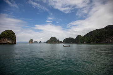 Obraz premium Landscape of Phi Phi island scenic beautiful place in sunny day, Traveling with wooden boat adventure famous nature sea beach Krabi, Travel Phuket Thailand, Summer holidays vacation trip, Tourism Asia