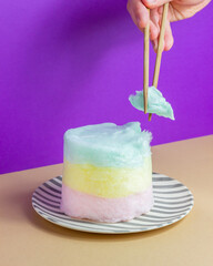 Cotton Candy on a purple background. Minimal concept. Idea.