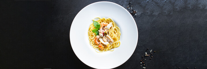 spaghetti seafood pasta shrimp, mussels, squid second course healthy meal top view copy space for text food background