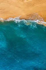 Sierkussen Beautiful sandy beach with blue water, vertical photo. Wild beach with beautiful clear sea. Yellow sand with blue sea. Clean beach with clean sea. Ocean from a bird's eye view. Copy space © MISHA