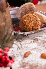 wooden background with flour in the kitchen with desserts and christmas decorations