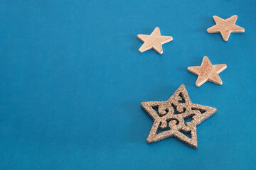 Fototapeta na wymiar Traditional christmas blue background with silver stars for greeting lettering or announcement