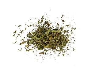 Dried mint herb isolated on white background. A handful of dried mint leaves. 